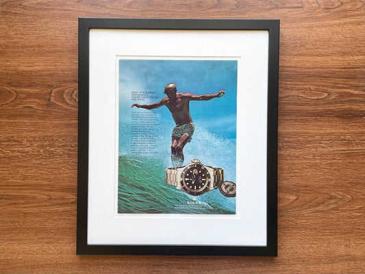 1978 Rolex Submariner with Surfer Advertisement in Black Wood Frame