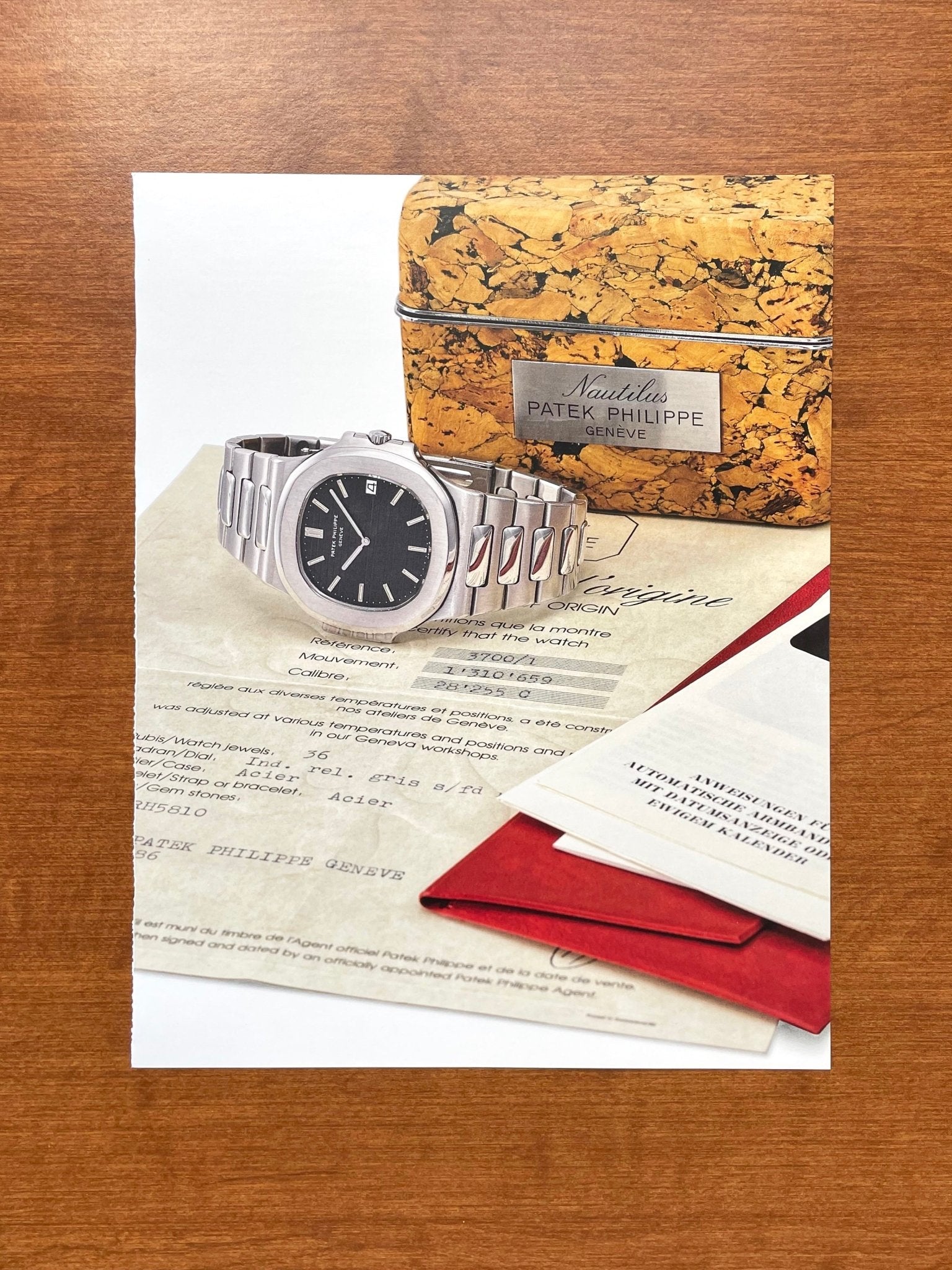 Original Auction Catalog page showing Patek Philippe Nautilus Ref. 3700 w/ box & papers